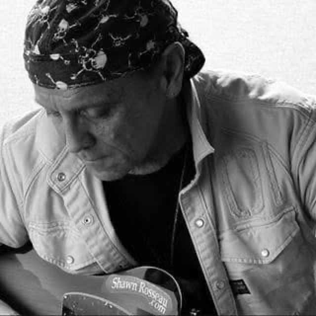 Shawn Rosseau with his guitar